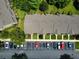 Aerial view of condos with assigned parking spaces and green landscaping at 783 Shropshire Loop, Sanford, FL 32771