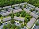 Aerial view of a community with condos, parking and green landscaping at 783 Shropshire Loop, Sanford, FL 32771