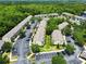 Overhead view of condos with parking lots surrounded by mature trees at 783 Shropshire Loop, Sanford, FL 32771