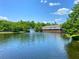 Waterfront property overlooking a beautiful lake with a fountain at 783 Shropshire Loop, Sanford, FL 32771