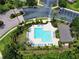 Overhead drone shot of community swimming pool area and green landscaping at 783 Shropshire Loop, Sanford, FL 32771