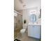 Bright bathroom with glass enclosed shower, white vanity, and neutral tones at 818 Sugar House Blvd, Port Orange, FL 32129