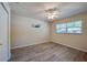 Light-filled bedroom with ceiling fan, and wood-look flooring at 818 Sugar House Blvd, Port Orange, FL 32129
