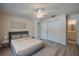 Bedroom with new flooring, ceiling fan, ensuite bathroom, and closet at 818 Sugar House Blvd, Port Orange, FL 32129