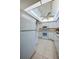 Bright kitchen features recessed lighting, neutral countertops, and white appliances at 818 Sugar House Blvd, Port Orange, FL 32129