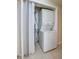 Efficient laundry closet with a stacked washer and dryer set at 818 Sugar House Blvd, Port Orange, FL 32129