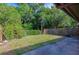 A grassy backyard with a concrete patio is fenced in for privacy at 834 Sugar House Dr, Port Orange, FL 32129