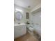 Bright bathroom featuring a shower/tub combination and a modern vanity with a round mirror at 834 Sugar House Dr, Port Orange, FL 32129