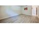 Empty bedroom with wood-look floors and natural light; bright and clean at 834 Sugar House Dr, Port Orange, FL 32129