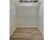 Empty walk-in closet with wooden floors and wire shelving at 834 Sugar House Dr, Port Orange, FL 32129