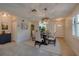A bright dining room with elegant lighting, neutral paint, and tile flooring at 834 Sugar House Dr, Port Orange, FL 32129