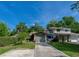 Charming two-story home with a well-maintained lawn, lush landscaping, and a concrete driveway at 834 Sugar House Dr, Port Orange, FL 32129
