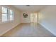 Bright, spacious room with tile flooring, plantation shutters and fresh neutral paint at 834 Sugar House Dr, Port Orange, FL 32129