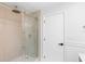 Modern bathroom features a glass shower with gold hardware at 9720 Fairway Cir, Leesburg, FL 34788