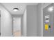 Hallway with neutral walls and light wood-look flooring at 9720 Fairway Cir, Leesburg, FL 34788