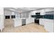 Spacious kitchen with stainless steel appliances, stylish countertops, and a functional island at 9720 Fairway Cir, Leesburg, FL 34788
