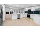 Spacious kitchen with stainless steel appliances, stylish countertops, and a functional island at 9720 Fairway Cir, Leesburg, FL 34788