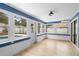 Bright lanai with a view of the pool and backyard at 9720 Fairway Cir, Leesburg, FL 34788