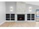 Living room features a stone fireplace with built-in shelving at 9720 Fairway Cir, Leesburg, FL 34788