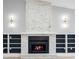 Living room features a stone fireplace with built-in shelving at 9720 Fairway Cir, Leesburg, FL 34788