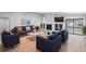 Bright living room featuring stylish furniture, modern decor, and a cozy fireplace with mantel at 9720 Fairway Cir, Leesburg, FL 34788