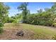 Spacious backyard perfect for outdoor living and entertaining with mature trees at 990 W French Ave, Orange City, FL 32763