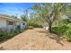 View of backyard landscaping in a quaint, charming single-Gathering home at 990 W French Ave, Orange City, FL 32763