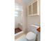 Modern bathroom featuring a tiled shower with built in bench and modern commode at 990 W French Ave, Orange City, FL 32763