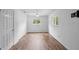 A bright bedroom with hard wood floors and natural light coming in from the backyard at 990 W French Ave, Orange City, FL 32763