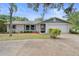 Charming single-story home with an attached garage and well-maintained landscaping in a desirable neighborhood at 990 W French Ave, Orange City, FL 32763