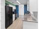 Bright kitchen featuring white cabinets, stainless steel appliances, and granite countertops at 990 W French Ave, Orange City, FL 32763