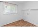 Functional laundry room with bright lighting, modern flooring, and shelving at 990 W French Ave, Orange City, FL 32763