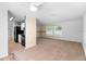 Inviting living area featuring neutral carpeting and an open layout, connecting to the kitchen and dining spaces at 990 W French Ave, Orange City, FL 32763