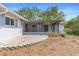 Covered and screened patio area has brick pavers and access into the home at 990 W French Ave, Orange City, FL 32763