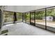 Spacious screened-in porch provides a pest-free outdoor living area with a view of the backyard at 990 W French Ave, Orange City, FL 32763