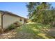 Manicured backyard with lush green grass and mature trees at 1120 W Glen Falls Rd, Deland, FL 32720