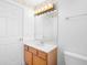 Bathroom featuring a wood vanity, single sink, and warm lighting at 1120 W Glen Falls Rd, Deland, FL 32720