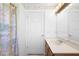 Bathroom featuring a single sink with a floral shower curtain at 1120 W Glen Falls Rd, Deland, FL 32720