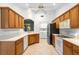 Well-lit kitchen with stainless steel appliances and white counter tops at 1120 W Glen Falls Rd, Deland, FL 32720