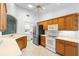 Bright kitchen features stainless steel appliances and plenty of cabinet storage at 1120 W Glen Falls Rd, Deland, FL 32720