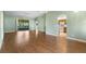 Spacious open floor plan with laminate flooring, large sliding doors and easy access to kitchen at 1120 W Glen Falls Rd, Deland, FL 32720