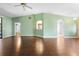 Expansive living room featuring wood floors and a view to the kitchen at 1120 W Glen Falls Rd, Deland, FL 32720