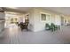 Community clubhouse covered porch with seating and charming details at 1120 W Glen Falls Rd, Deland, FL 32720