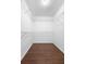 Walk-in closet featuring wire shelving and hardwood flooring at 1120 W Glen Falls Rd, Deland, FL 32720