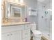 Bright bathroom featuring a vanity with granite countertops and a glass-enclosed shower at 114 Ocean Aire N Ter, Ormond Beach, FL 32176