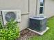 View of two air conditioning units outside a home, including a Costway and a Carrier unit, for optimal climate control at 119 Fishermans Cove Dr, Edgewater, FL 32141