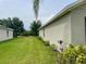 Spacious backyard with manicured lawn, offering ample space for outdoor activities at 119 Fishermans Cove Dr, Edgewater, FL 32141