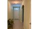 A welcoming entryway with tiled floors, neutral walls, bench, and decorative archway at 119 Fishermans Cove Dr, Edgewater, FL 32141