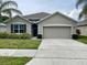 Charming single-story home with a well-maintained front yard, featuring a two-car garage at 119 Fishermans Cove Dr, Edgewater, FL 32141