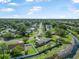 A serene aerial view of a home in a well-maintained neighborhood with lush greenery and community features at 1191 Tracy Dr, Port Orange, FL 32129